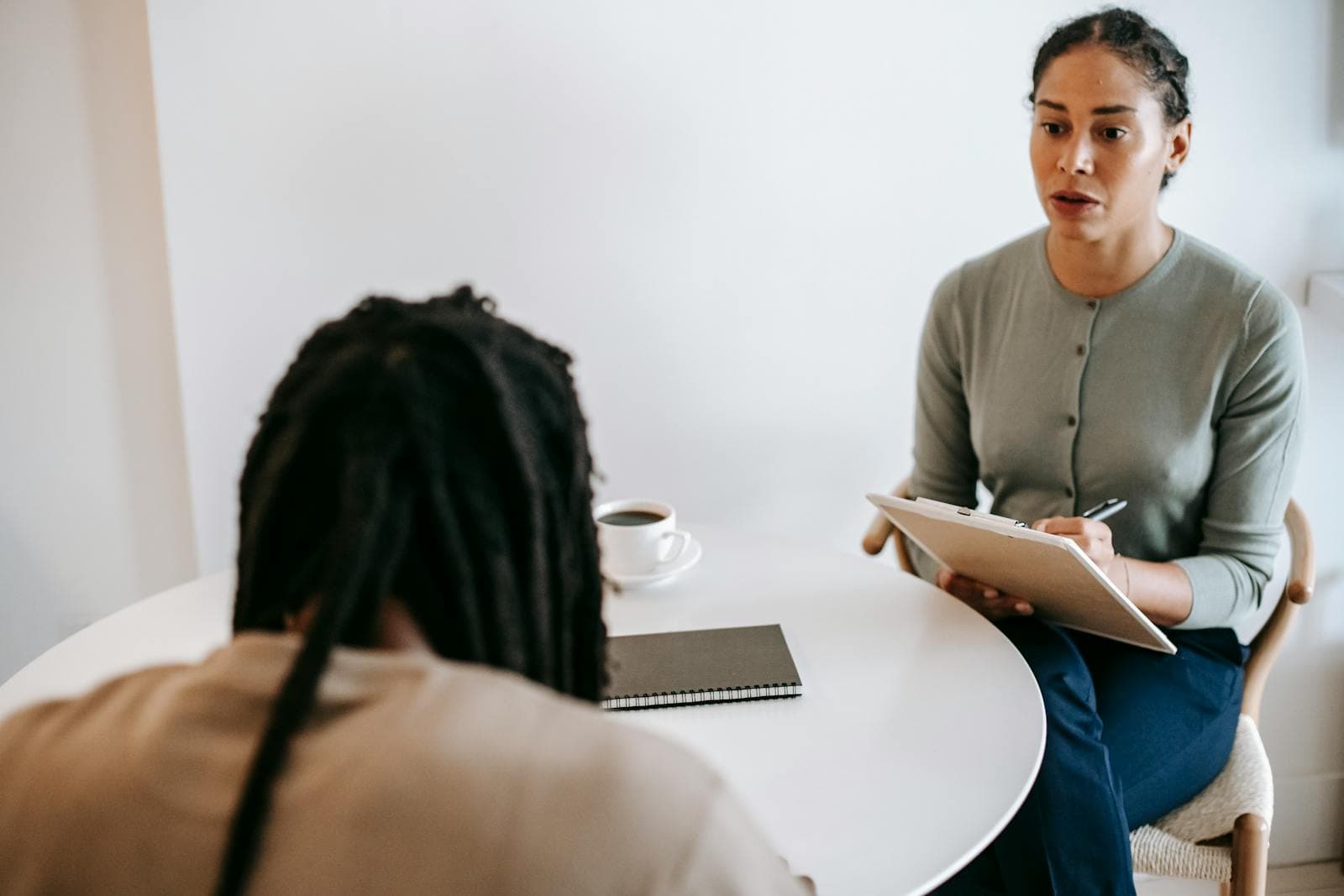 Care coordinator planning personalized NDIS care with participant and family